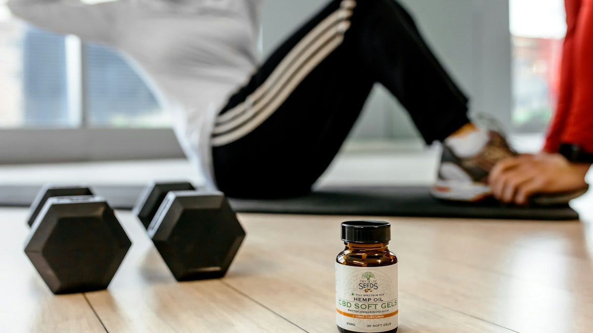 black dumbells and white-labeled bottle